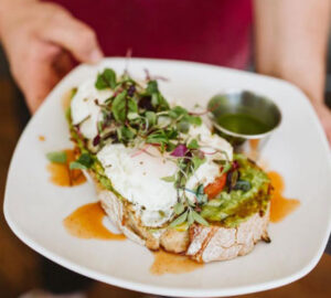 Poached pastured eggs atop avocado toast with microgreens make an undeniably delicious breakfast at Switchback Coffee in Colorado Springs