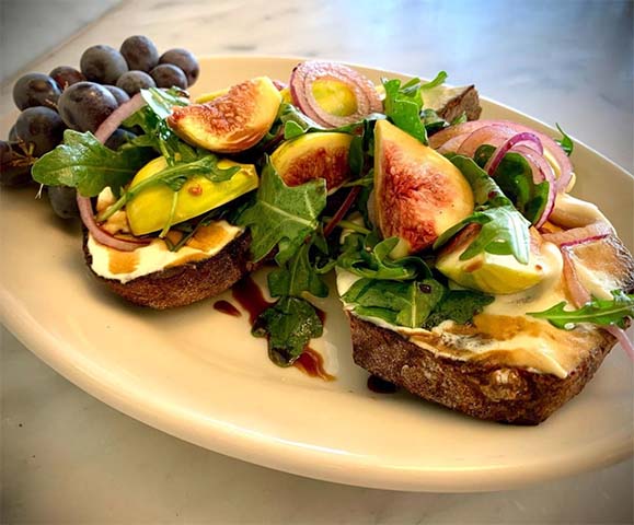 Seasonal toast with greens and fruit at M.H. Bread & Butter in San Anselmo, CA